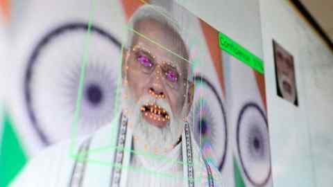 Prime Minister Narendra Modi's face is scanned on a screen to create an avatar